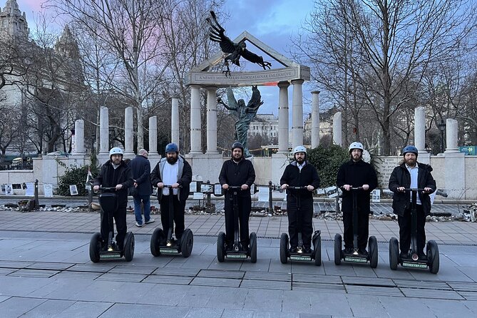 1 Hour Budapest Segway Tour - Parliament Hightails - Shoes on the Danube Bank: the heavy stop that anchors the ride