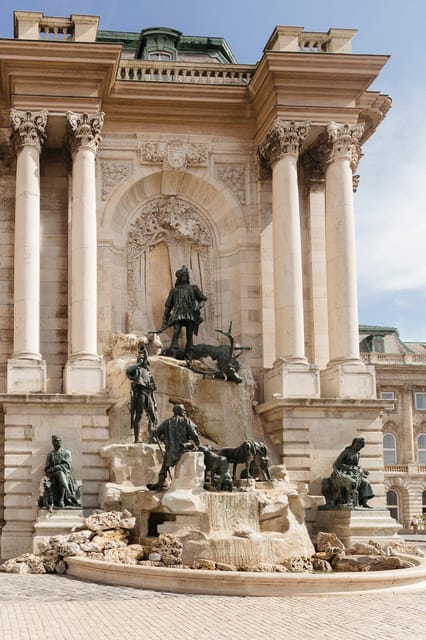 Budapest: Buda Castle Walking Tour & Folk Music Performance - Buda Castle Royal Palace, plus King Matthias and the wine-fountain detail