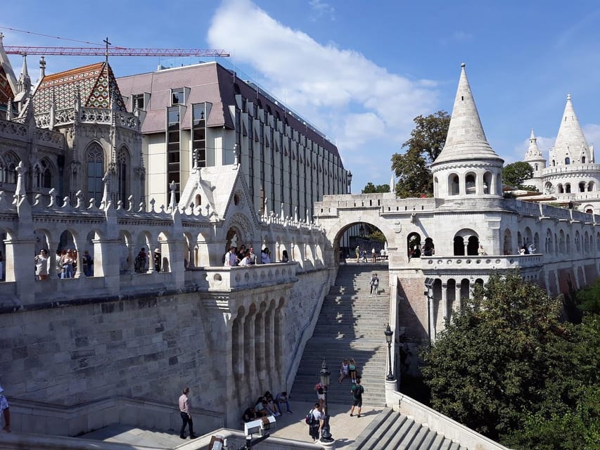 Budapest: Buda Castle Walking Tour & Folk Music Performance - Tárnok Street, where old buildings keep changing the visual language
