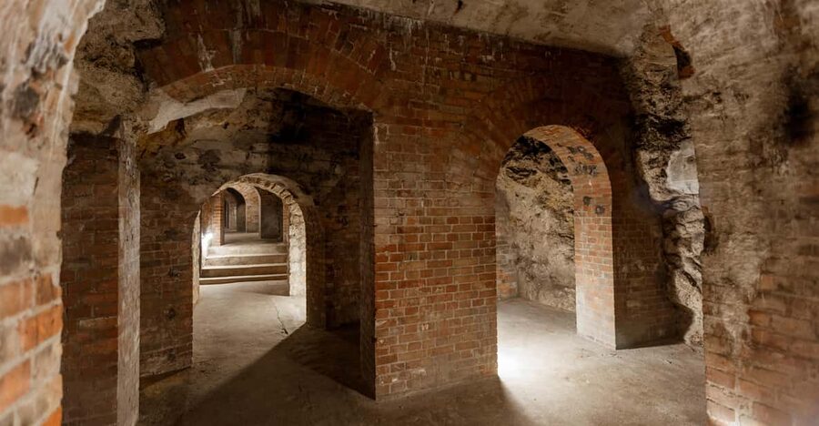 Budapest: The WWII Siege of Buda Castle & Bomb Shelter Tour - Entering the Buda Castle Cave: Cold Air, Narrow Corridors, Real Scale