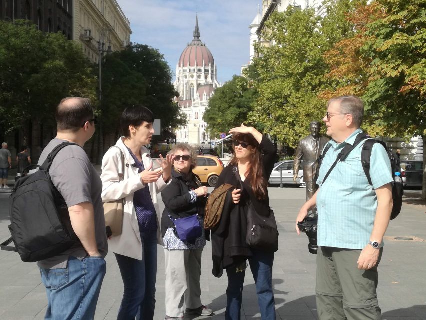 Communist Budapest Walking Tour - The House of Terror and the Berlin Wall slab: the cost of the system