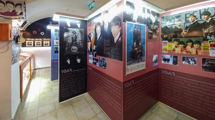 EGRI ROAD BEATLES MUSEUM - The display cases: press, clothing, flags, rarities, and replicas